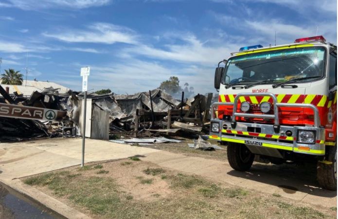 A firetruck is parked beside the burnt-out rubble of Mungindi's only supermarket.